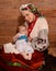 Ukrainian mother breastfeeding and hugging her baby.