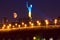 The Ukrainian Motherland Monument is illuminated with the blue and yellow