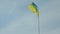 Ukrainian national flag flying waving on flagpole