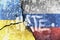 Ukrainian and russian flag painted on concrete wall with the text hate on top. war and conflict concept