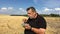 Ukrainian senior farmer eating steamed vegetables sitting outdoor