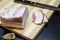 Ukrainian traditional meal. Slices of salted pork lardon with garlic and knife on the wooden background