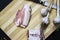 Ukrainian traditional meal. Slices of salted pork lardon with garlic and knife on the wooden background