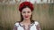 Ukrainian woman walking in embroidery vyshivanka dress on reed nature background. Symbol of Ukraine, national identity