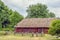 Ukrainian wooden barn Thatched locked up