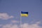 Ukranian flag against a blue sky