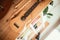 Ukulele: Close up of ukulele and flutes, ready to play, hanging on a wooden bookshelf