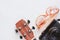 Ukulele with sunglasses and camera on white background