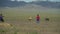 Ulan Bator / Mongolia, May, 3.2019: Mongolian shepherds catch horses with a rope