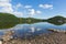 Ullswater by Pooley Bridge Lake District Cumbria rocky shore blue sky and sunshine