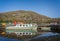 The Ullswater Steamer MV Lady Dorothy moored at the jetty in Glenridding with colourful reflections in Glenridding, Cumbria, UK