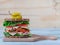 Ultimate Deli Sandwich on grey background