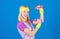 Ultimate upper body workout for women. Fitness instructor hold little dumbbell blue background. Fitness concept. Girl