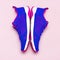 Ultra blue violet pink female sneakers on pastel pink background flat lay top view with copy space. Sports shoes, fitness, concept