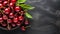 Ultra-detailed Top View Of Cherry In Wooden Dish On Dark Gray Stone Background