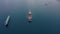 Ultra large container ship at sea port near cargo vessel, aerial view