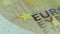 Ultra Macro, Close Up of Euro Bank Note, Focus on EURO EYPO Sign. Hand shooting