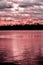 Ultra Violet Sunset on Lake with Storm Clouds