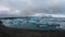 Ultra wide angle view of jokulsarlon glacier lagoon, Iceland, viewed from above, tourists enjoying the view