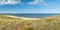 Ultra wide high res panorama of dunes, beach and ocean