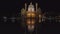 An ultra wide night shot of st charles church reflected in a pool at vienna