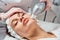 Ultraformer lifting. Face Skin Care. Close-up Of Woman Getting Facial Hydro Microdermabrasion Peeling Treatment At