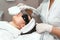 ultraformer lifting. Face Skin Care. Close-up Of Woman Getting Facial Hydro Microdermabrasion Peeling Treatment At