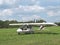 Ultralight aircraft in grassy field