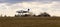 Ultralight plane take off from runway on airports with cloud sky. Panning photo