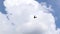 Ultralight small propeller-driven private jet flying in the sky with clouds over the airfield. Rear view of a turboprop aircraft t