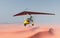 Ultralight trike over a sand desert
