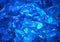 Ultramarine background of shiny-crystal stones lit mysterious gloww