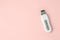 Ultrasonic peeling device with modes on pink background, minimal beautycian concept, home salon procedure, wellness, skincare,