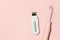 Ultrasonic peeling and dorsanvales device with modes on pink background, minimal beautycian concept, home salon procedure,