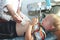 An ultrasound doctor makes an ultrasound of the abdominal cavity of the child. The boy is being examined in the office of the