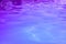 Ultraviolet water of pool or sea with waves and sunlight glares at surface