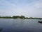 Ultrawide angle shot that present insane nature of rural view.River, boat,sky and trees a perfect symbol of country life.