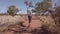 Uluru woman walking Base walk