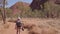 Uluru woman walking with camera
