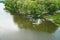 Ulyanovsk, Russia - july 17, 2022: Kayaking on the Sviyaga river. A young Caucasian man sits in a kayak and paddles