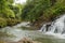 Uma Anyar waterfall, Bali, Indonesia. Jungle, forest, daytime with cloudy sky