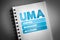 UMA - Unified Managed Account acronym on notepad, business concept background