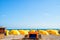 Umbrella and chair on white sand at blue sea