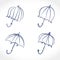 Umbrella. Hand drawn four umbrellas line art icons set.