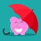 The umbrella is a shield to protect the piggy bank. Money protection concept. safe investment