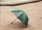 Umbrella on sidewalk in rainy weather