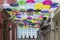 Umbrellas Above San Juan Streets and Mansion