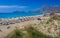 Umbrellas on the beach and emerald seas at Falassarna beach in Western Crete, Greek Islands, Greece, Europe