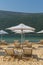 Umbrellas and beach loungers on golden beach