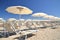 Umbrellas and chairs on beautiful beach Marina di Vecchiano nearby Pisa in Italy